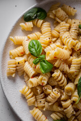 Italian pasta with greens and cherry tomatoes