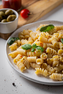 Dinner with italian pasta with basil and tomatoes