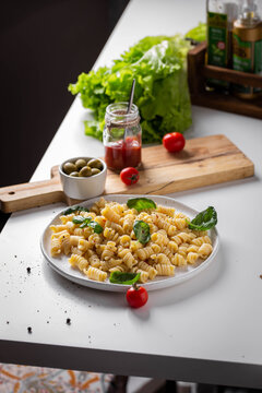 Italian pasta with greens and cherry tomatoes
