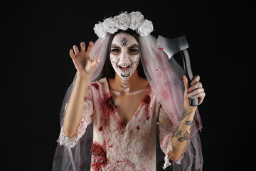 Beautiful young woman dressed as dead bride for Halloween party with axe on black background