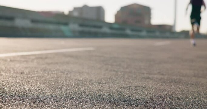 Person, legs and start on road for running, fitness or outdoor cardio exercise in urban town or city. Closeup of athlete or runner getting ready for run in sports motivation, training or workout