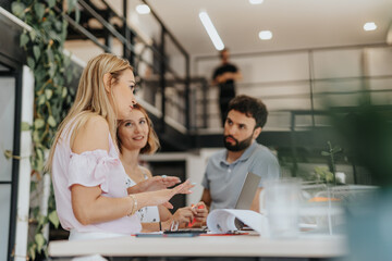 Cross generational business team working on a new project in modern office and positive working atmosphere.