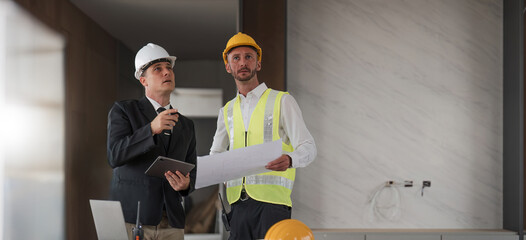 Diverse Team of Specialists Use Laptop on Construction Site. Real Estate Building Project with Engineer Investor and Businessman Checking Area, working on Civil Engineering, Discussing Strategy Plan