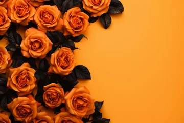 Fototapeten orange and black roses pattern frame on an orange background for Halloween © World of AI