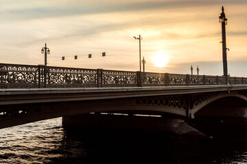 Blagoveshchensky Bridge across the Neva River in St. Petersburg. Bridges of the city at sunset.