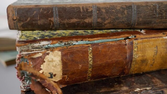 Close up of very old books. Restoration of books in archives. Vilnius, Lithuania - 06/06/2023.