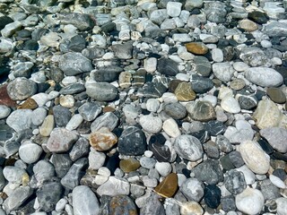 Aerial view of pebbles in crystal clear Shala river, Albania.