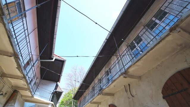 Krakow Poland Schindler's list passage building memorial from World War II Nazi German occupation with looking low angle view on house home balcony