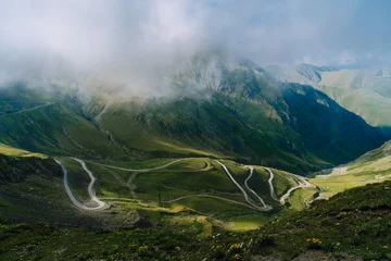 Fotobehang Mountain pass in Georgia in summer. Views from one of the most dangerous road on the world in Georgia. Road to Omalo.  Abano pass in the Caucasus mountains. Top view of winding road. © Ksenya