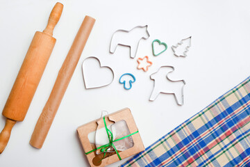 box with gingerbread dough and baking mold on white table. Christmas cookies paper for baking. biscuits for New Year Celebration. gift box