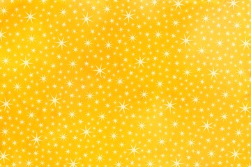 Bright stars on yellow background, different sizes of stars, different shades of yellow. Large number of stars on the surface. Christmas backdrop.