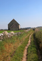 Fototapeta na wymiar Agricultural building by a rural track, Derbyshire England 