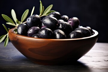 Many fresh and ripe black olives in wooden bowl, healthy food concept. Generative Ai.