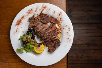 Meat steak in a restaurant. A meat dish