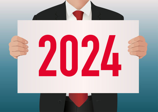 Pour présenter le bilan de son entreprise, un cadre dirigeant en costume cravate, porte une pancarte blanche sur lequel est écrit l’année 2024 .