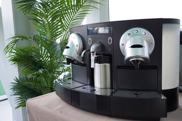 Coffee Machine with capsules on table