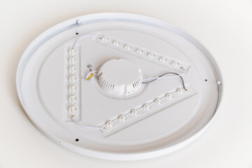 close-up. round lamp with LED bulbs on a white surface. 