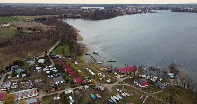 Drone aerial view of Village on Czaplinek city in Poland near a lake where is also a camping spot