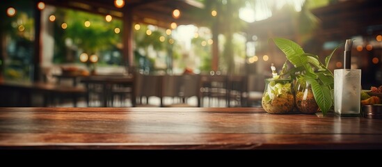 Naklejka na ściany i meble Blurry restaurant background with a table on top