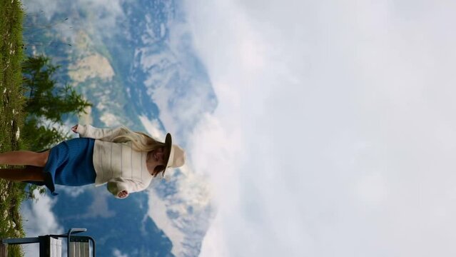 Girl enjoy view on Alp mountains 