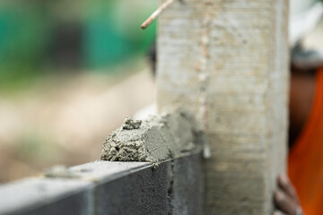 working cement on a brick