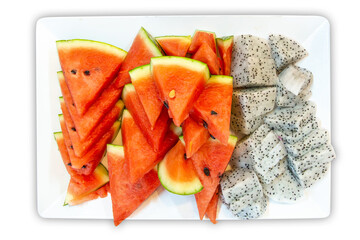 Top view of Watermelon and dragon fruit slice in the plate, focus selective