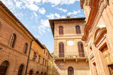 Fototapeta premium traditional architecture close to the Church of Saints Peter and Paul in Buonconvento, Province of Siena, Tuscany, Italy
