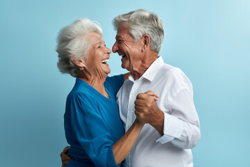 a elderly couple dancing happily and looking to each other in happiness