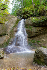 Fototapeta na wymiar mountainous terrain, river, waterfall cascade walks in the bosom of nature ,
