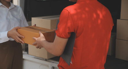 Asian Woman Receiving Product from delivery man at Home, Young Owner Woman Order Product from Smartphone Application, Woman with Online Business or SME Concept.