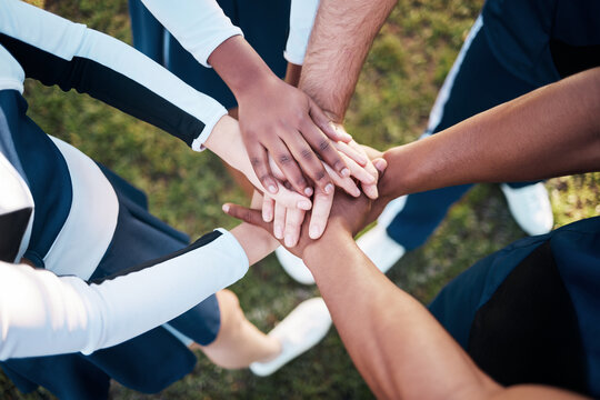 Hands, together and people in sports huddle for support and solidarity in athlete team with top view. Fitness group outdoor, collaboration and trust, mission in partnership synergy and game plan