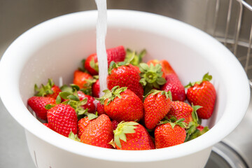 Wash strawberry in the kitchen