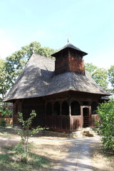 Fototapeta na wymiar A small church with a cross on top