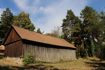 A wooden building with a wood roof