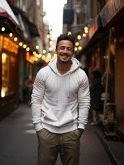 Fototapeta premium Male Model in white shirt on a city Street, smiling