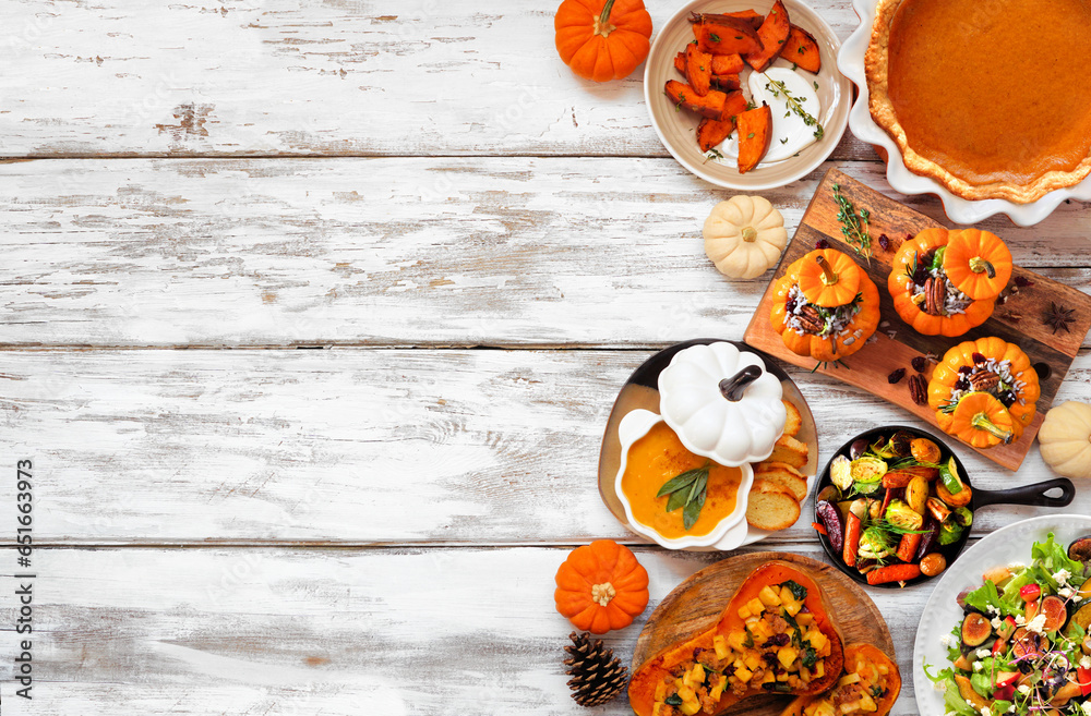 Wall mural delicious autumn meal side border. above view on a white wood background. stuffed pumpkins and squas - Wall murals