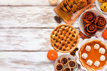 Autumn desserts side border. Table scene with an assortment of traditional fall sweet treats. Above...