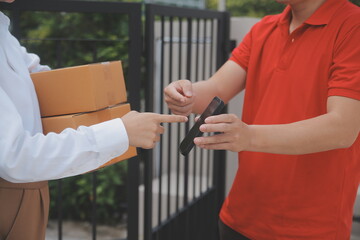 Asian Woman Receiving Product from delivery man at Home, Young Owner Woman Order Product from Smartphone Application, Woman with Online Business or SME Concept.