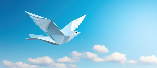 Origami dove symbolizes peace on blue sky background