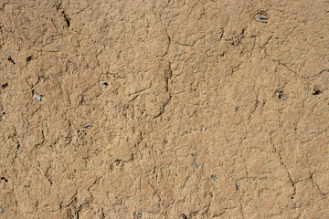 Grunged old wall, with multiple cracks, empty texture background