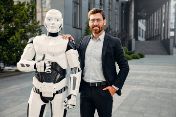 Robot with businessmen on the street near the building