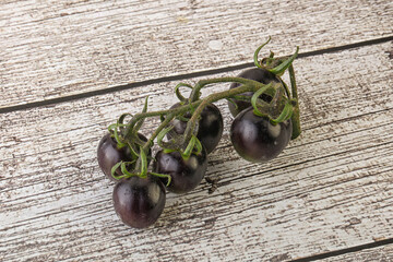 Ripe tasty black cherry tomato