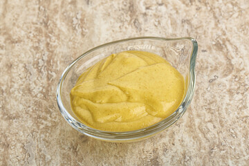 Organic mustard sauce in the bowl