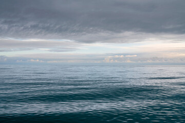 Fototapeta premium View of the Black Sea on the coast of Sochi against the sunset sky, Sochi, Krasnodar Krai, Russia