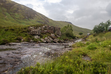 Fototapeta na wymiar River Coe and the hill Stob Mhic Mhartuin in the Scottish Highlands