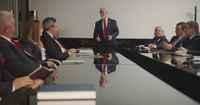 senior managers developing a strategy, CEO giving standing speech