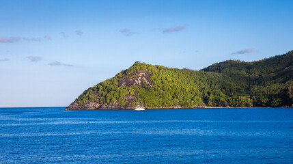 Wind turbines producing clean electricity at dawn in Victoria, Mahe Island, Seychelles