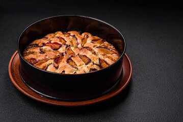 Delicious sweet aromatic homemade pie with ripe plums