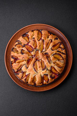 Delicious sweet aromatic homemade pie with ripe plums