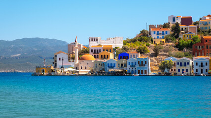 Meis (Megisti, Kastelorizo), the smallest of the twelve islands of Greece in the Aegean Sea, has houses with historical architecture and clear sea. - obrazy, fototapety, plakaty